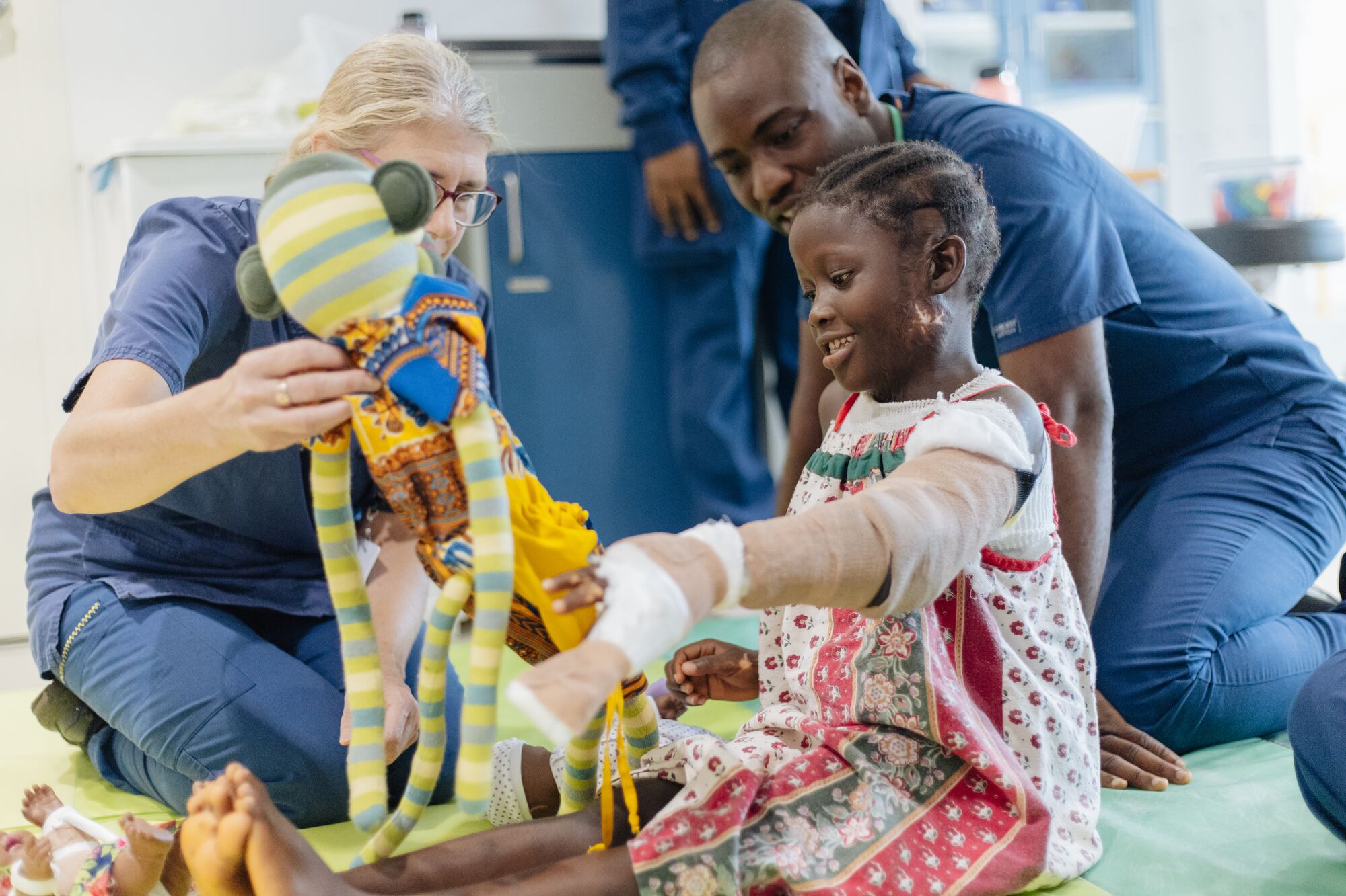 At eight, Musu received reconstructive surgery aboard the Global Mercy™, followed by weeks of rehabilitation to help restore movement to her hand.