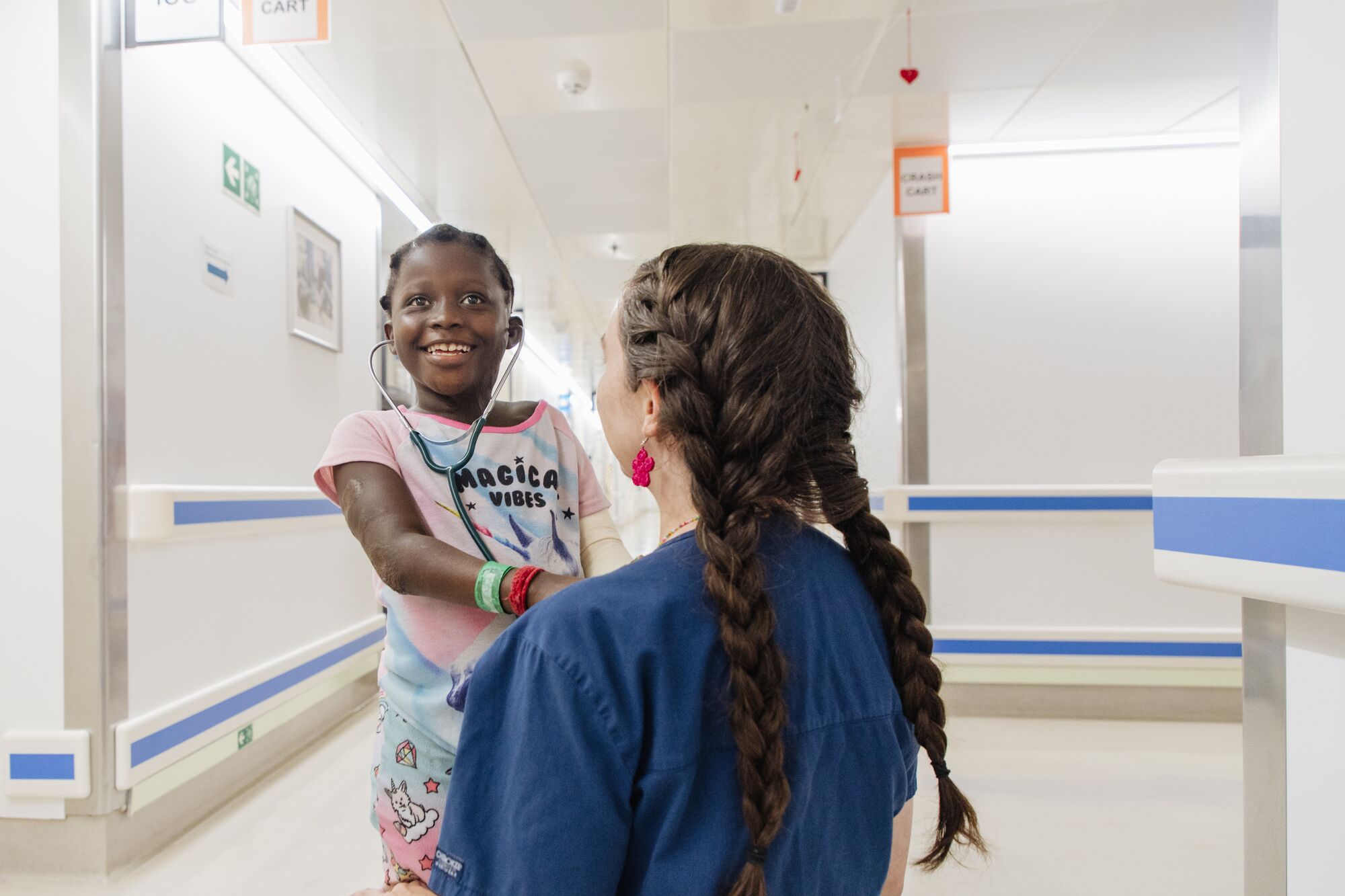 On the ward, Musu's playful spirit took over. "She became like a nursing assistant," Louisa Dunne remembered. "Once she wore a stethoscope and helped with the rounds. We had a lot of fun."