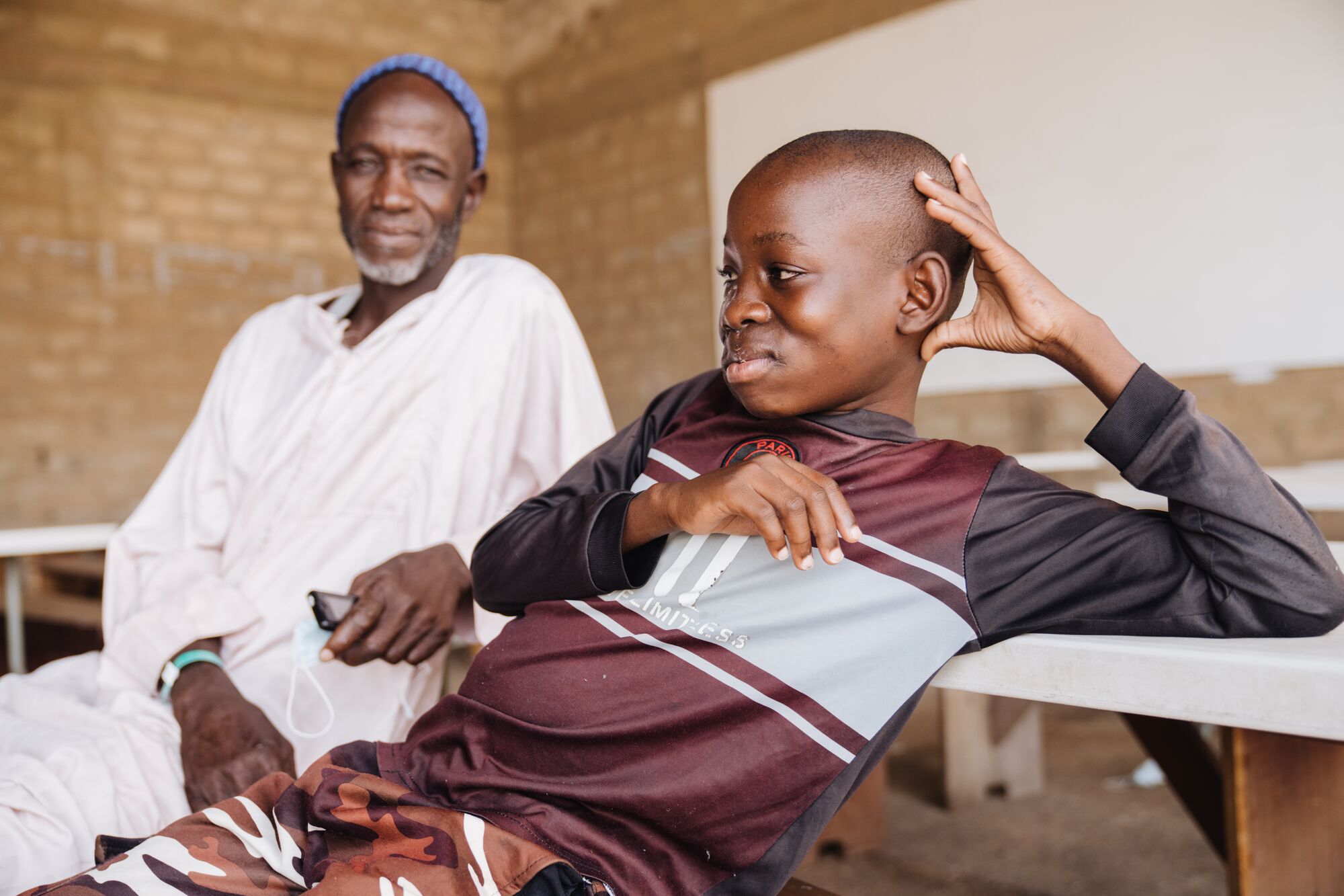He sat beside his son and held his hand. After years of searching, his son had finally received the treatment he needed.