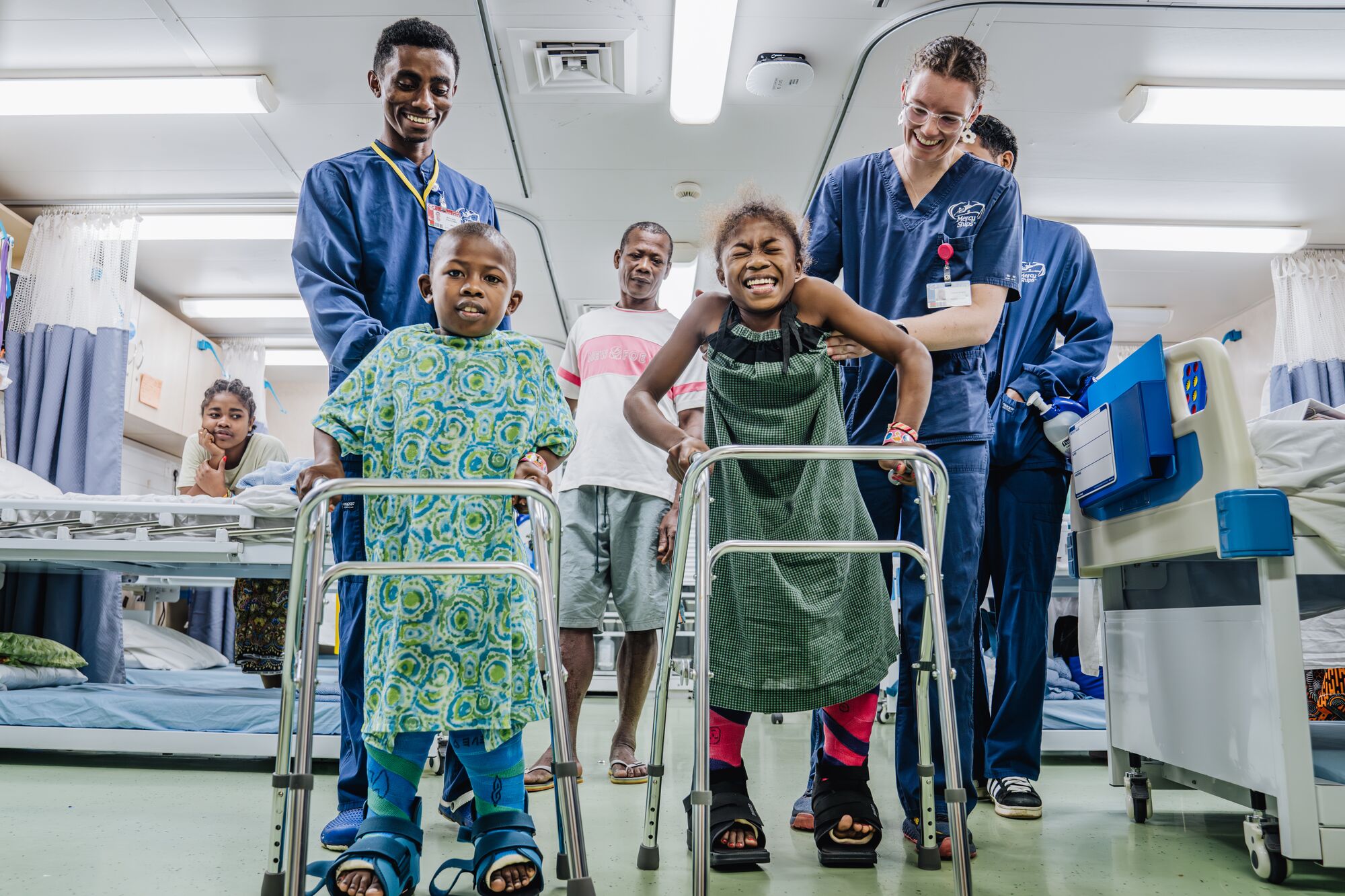 After surgery, both began the careful process of standing and learning to walk with their new alignment.